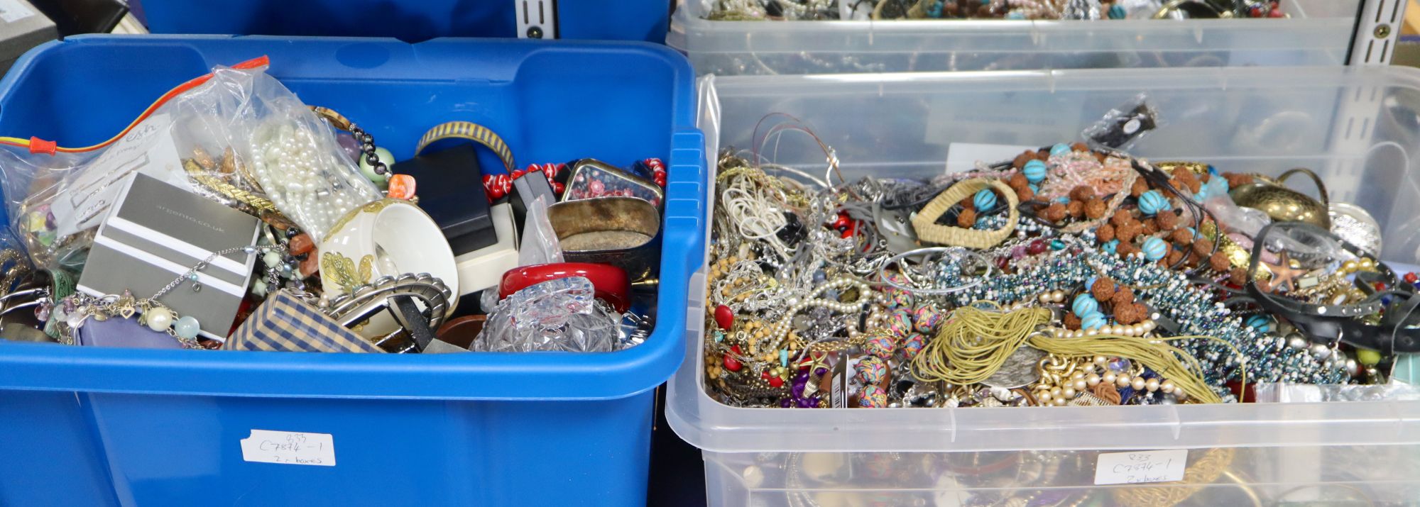 Two large boxes of assorted costume jewellery.